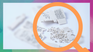 A blurred image of the pages of Genetic Alliance UK's Rare Disease Day report, with a sneak peek at a page in a magnifying glass illustration